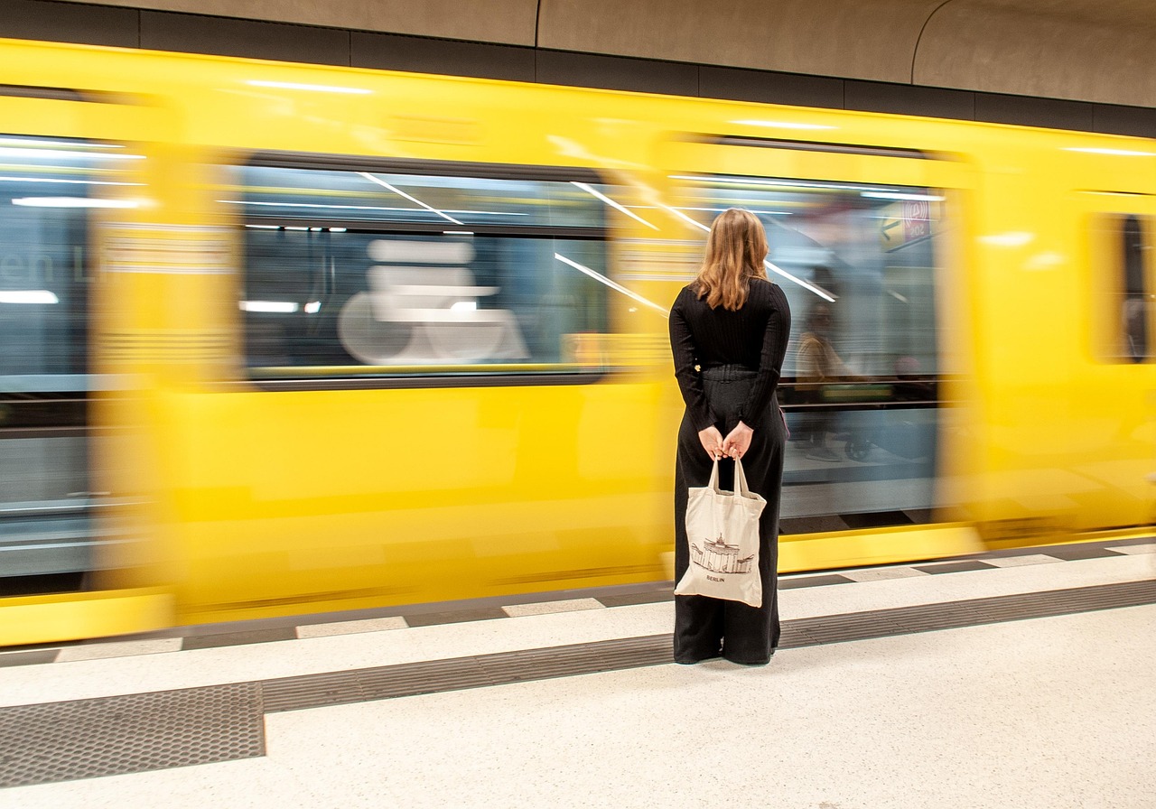 woman standing on train platform, missed opportunities, the tandem methods